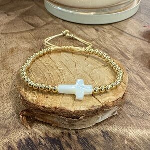 Gold Beaded Bracelet with White Cross Charm